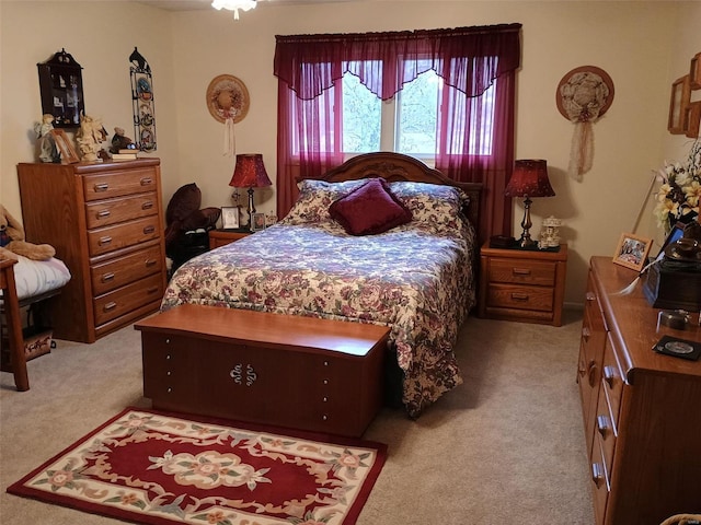 bedroom featuring light carpet