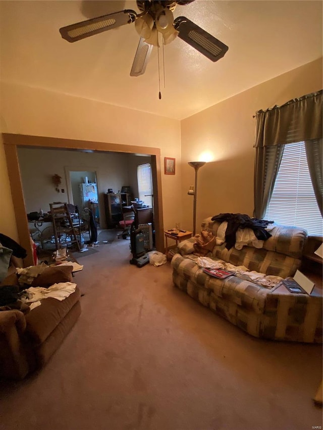 living room featuring ceiling fan and carpet floors