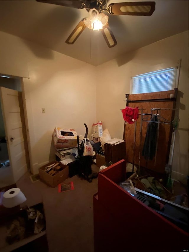 miscellaneous room featuring ceiling fan and carpet