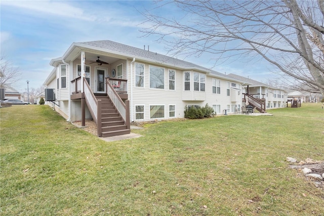 rear view of property with central AC unit, a lawn, ceiling fan, and a deck