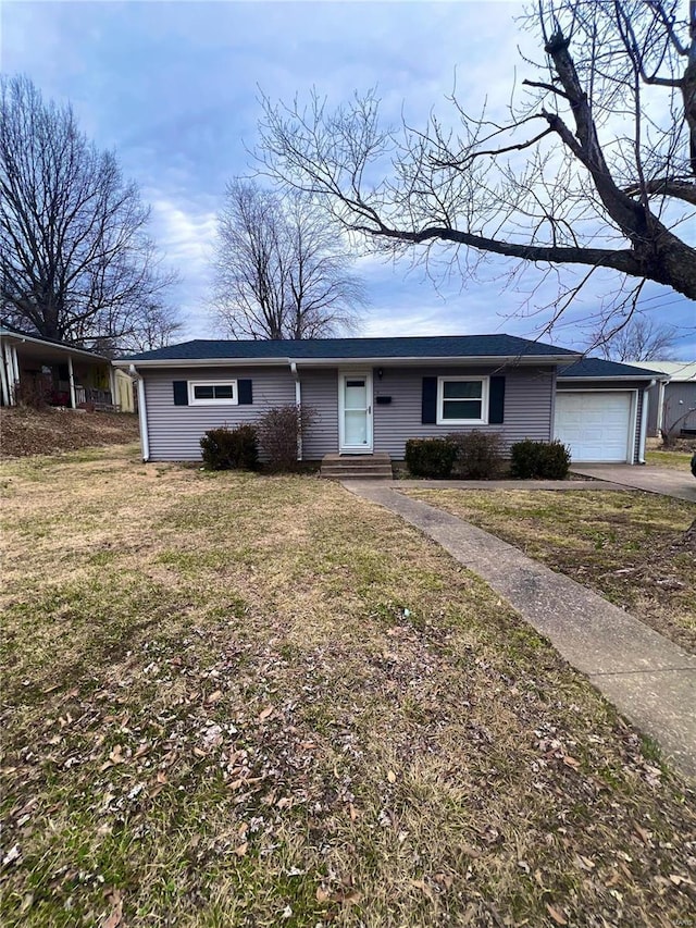 ranch-style house with a garage and a front yard