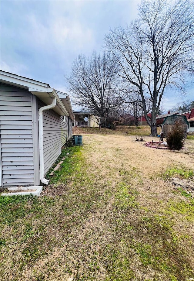 view of yard featuring central AC unit