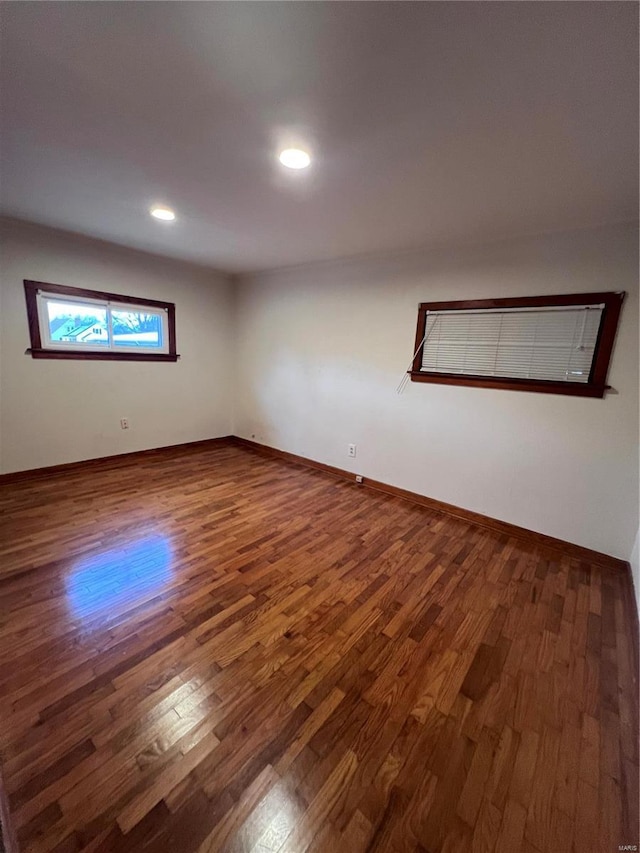 spare room featuring dark hardwood / wood-style flooring