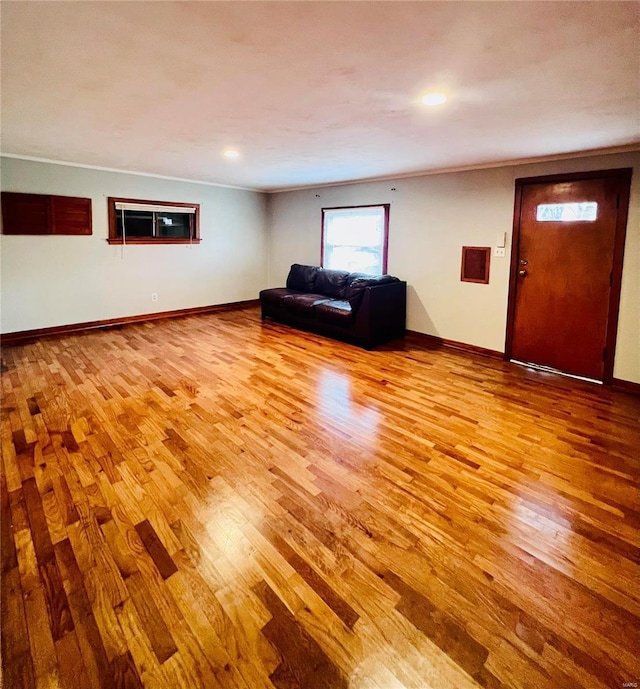 unfurnished living room featuring light hardwood / wood-style flooring