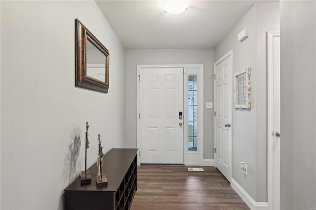 entrance foyer with dark hardwood / wood-style floors