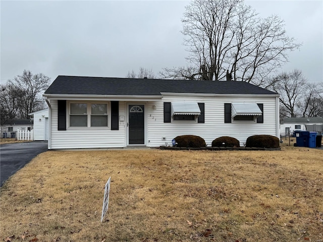 view of front of house with a garage and a front yard