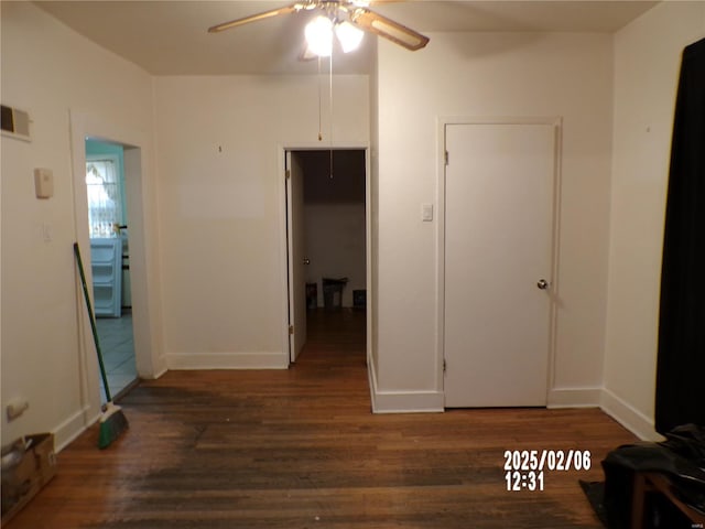 corridor featuring dark hardwood / wood-style flooring