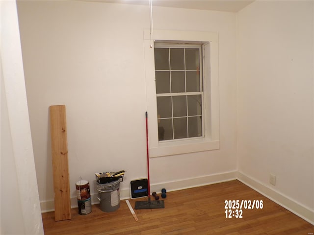 spare room with hardwood / wood-style flooring