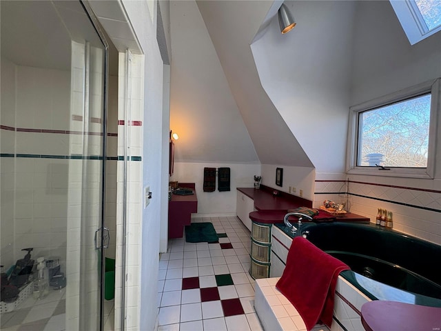 bathroom featuring walk in shower, tile patterned floors, and lofted ceiling