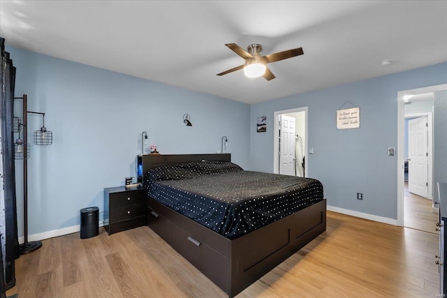 bedroom featuring baseboards, ceiling fan, and light wood finished floors