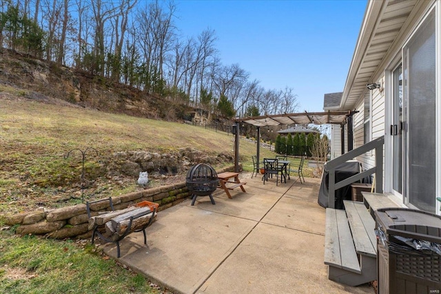 view of patio featuring outdoor dining space and a pergola