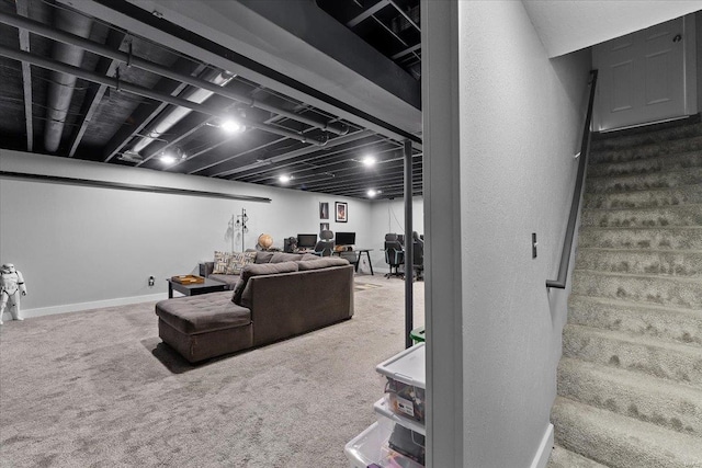 carpeted living area featuring stairs and baseboards