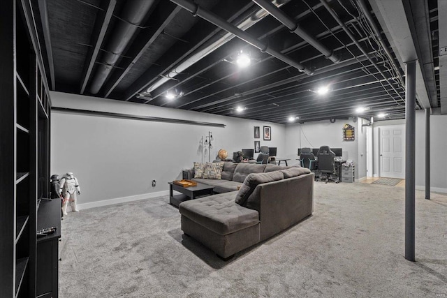 carpeted living area featuring baseboards