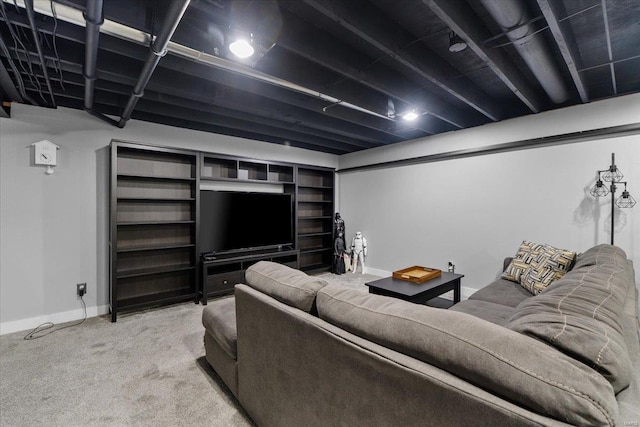 carpeted living area featuring baseboards