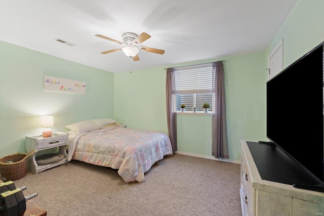 bedroom with ceiling fan, baseboards, visible vents, and light colored carpet