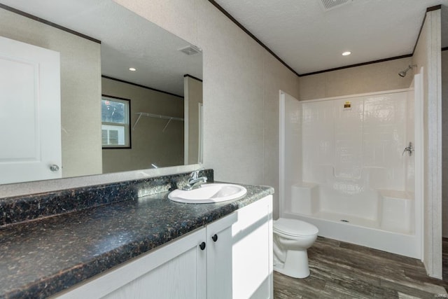 full bath featuring a shower, wood finished floors, toilet, and crown molding