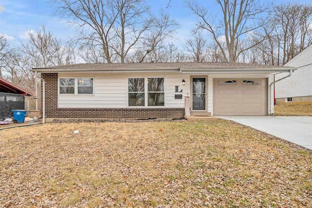 single story home featuring a garage and a front lawn