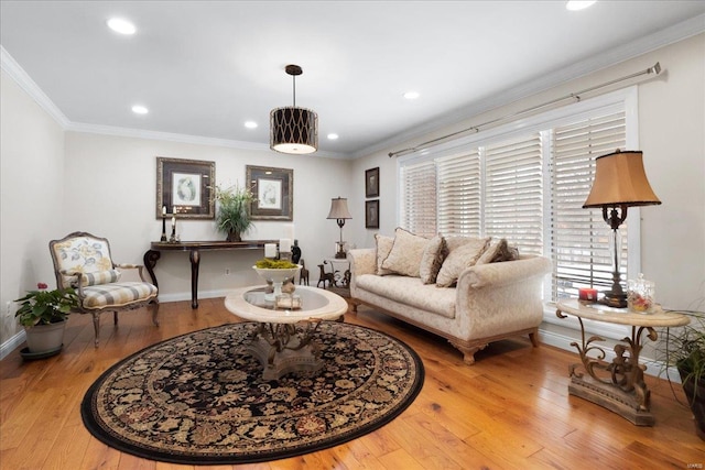 living room featuring ornamental molding, recessed lighting, wood finished floors, and baseboards