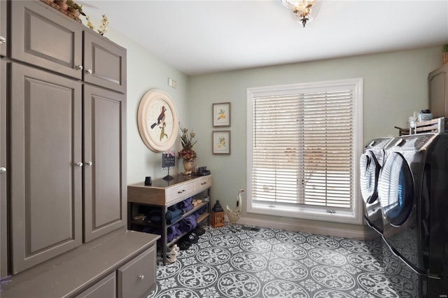 interior space with light tile patterned floors, baseboards, and separate washer and dryer