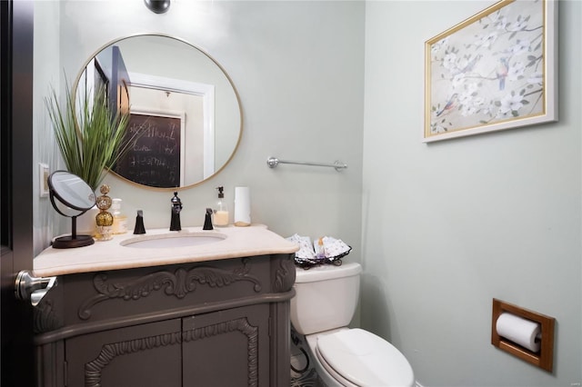 half bath with vanity and toilet