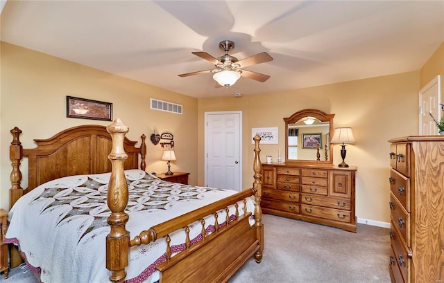 bedroom with ceiling fan and light colored carpet