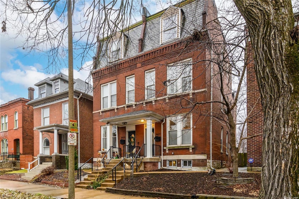 view of front of property featuring brick siding