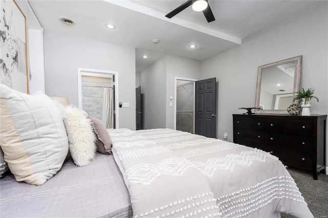 bedroom featuring connected bathroom, ceiling fan, and carpet flooring