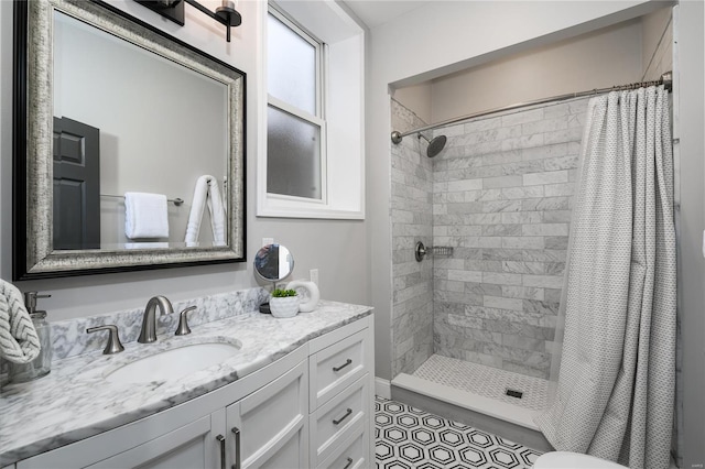 bathroom featuring vanity and a shower with shower curtain