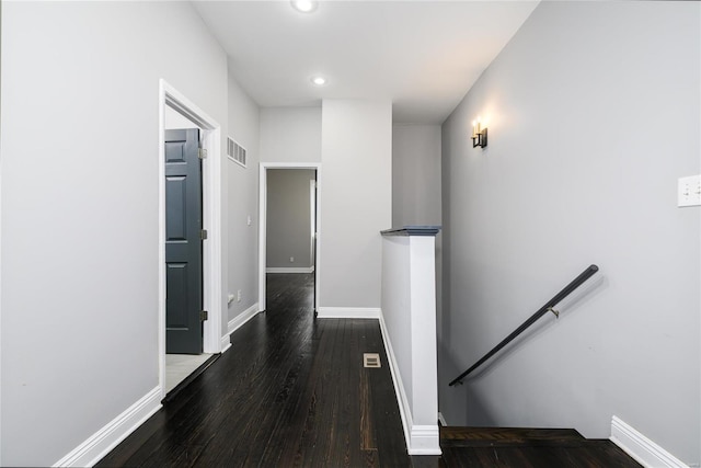 corridor featuring dark wood-type flooring