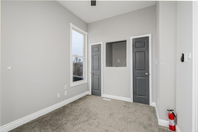 unfurnished bedroom featuring carpet