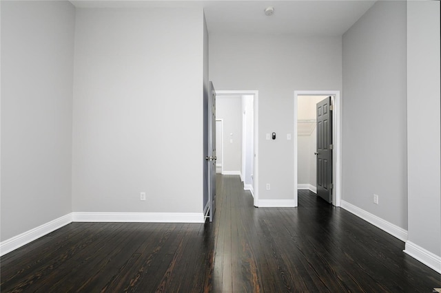 spare room with dark hardwood / wood-style flooring