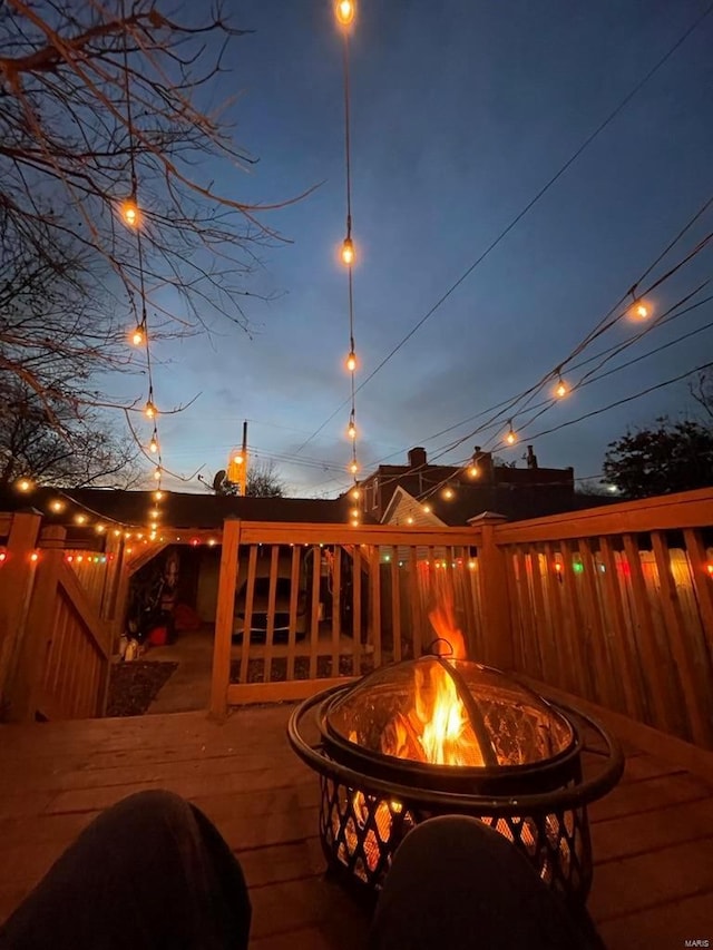 wooden terrace with a fire pit