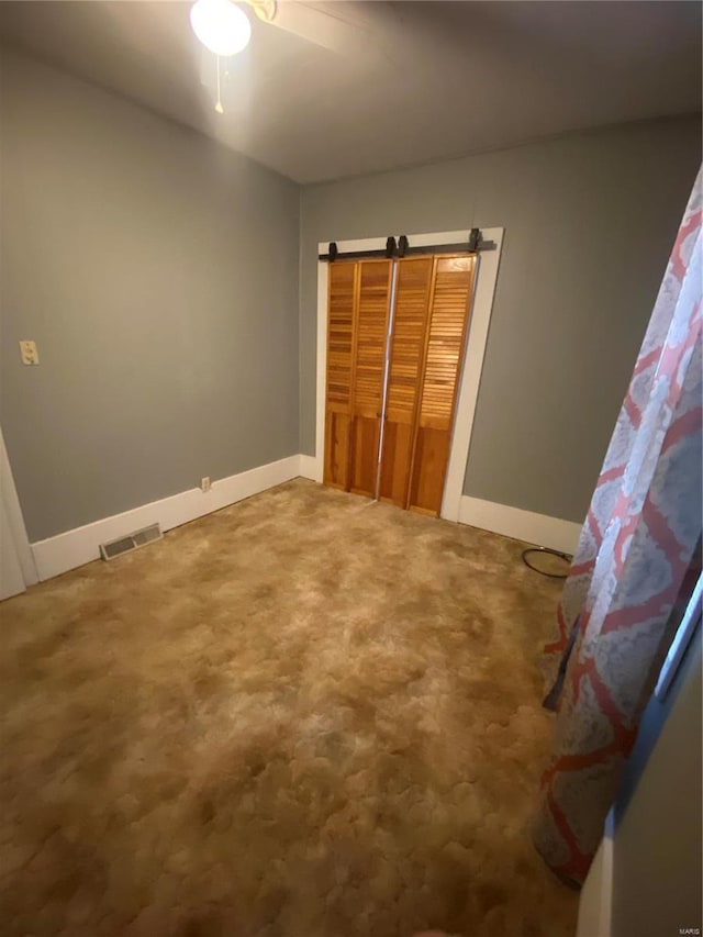 unfurnished bedroom featuring carpet