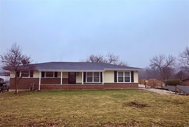 ranch-style home with a front yard