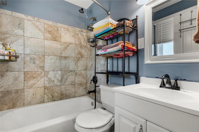 full bathroom featuring tub / shower combination, vanity, and toilet