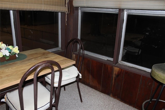 dining area featuring light colored carpet