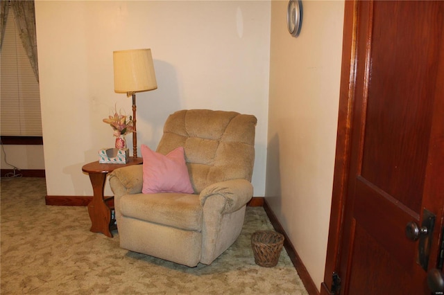 sitting room with light carpet and baseboards