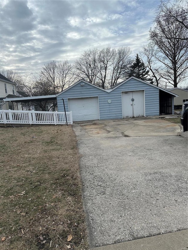 garage featuring a carport