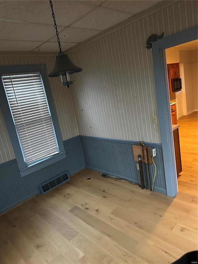 empty room with light hardwood / wood-style floors