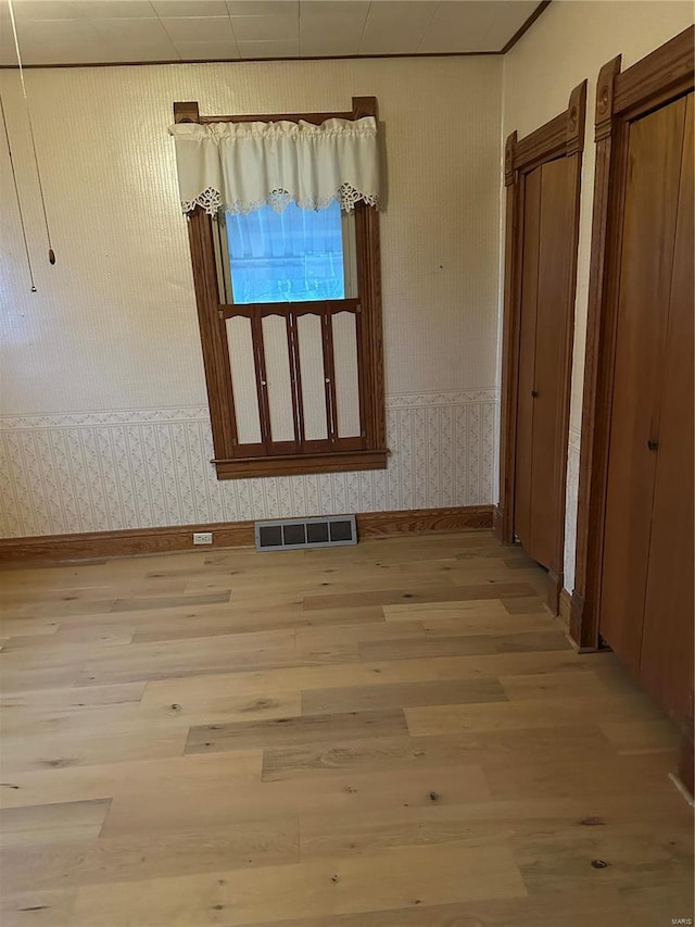 empty room with hardwood / wood-style floors