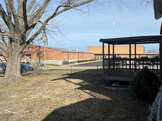 view of yard featuring fence and a wooden deck