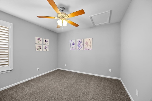 unfurnished room with attic access, carpet, ceiling fan, and baseboards