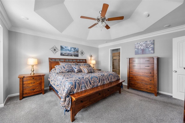 bedroom featuring light carpet, a ceiling fan, baseboards, ornamental molding, and a tray ceiling