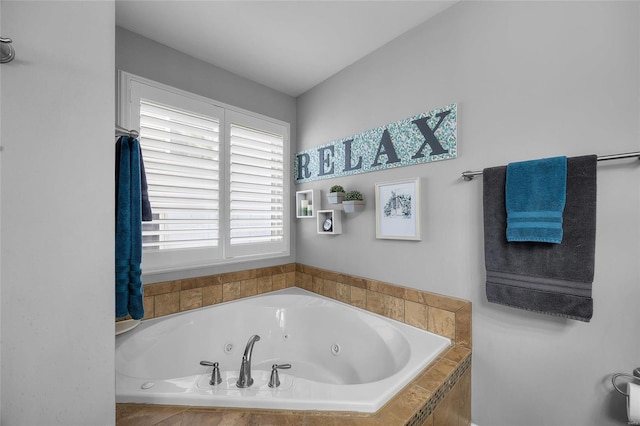 bathroom featuring a tub with jets