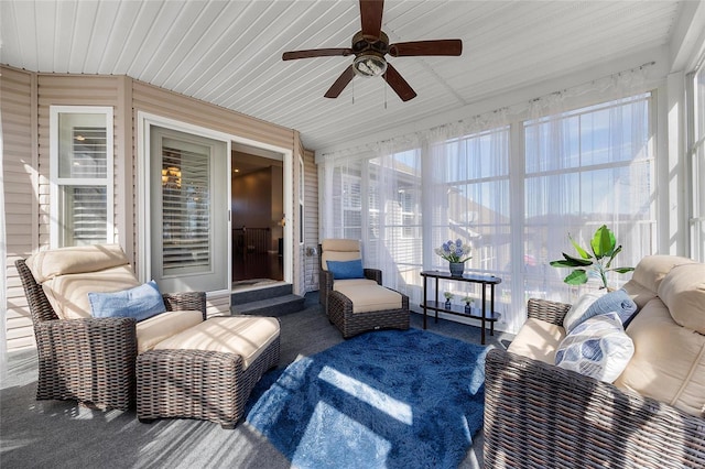 sunroom / solarium with a ceiling fan and a wealth of natural light