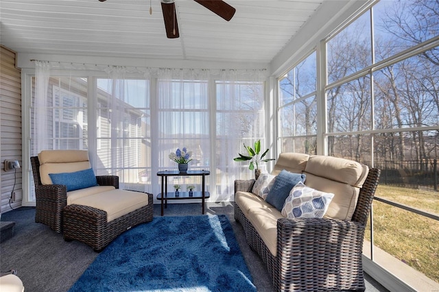 sunroom with plenty of natural light and a ceiling fan