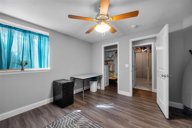 office with baseboards, dark wood finished floors, and a ceiling fan