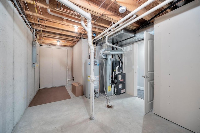 unfinished basement featuring gas water heater, electric panel, and heating unit