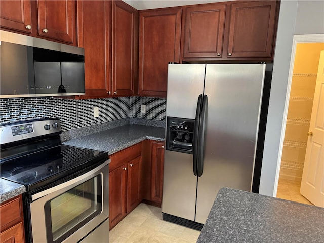 kitchen featuring stainless steel appliances and decorative backsplash