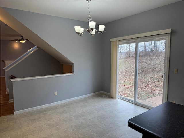 unfurnished dining area featuring a notable chandelier